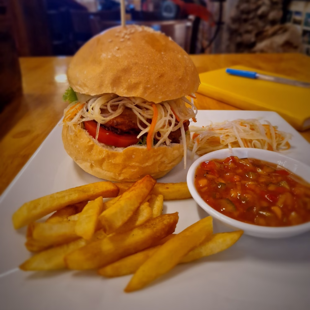 Buddha Belly Burger with two patties and chips